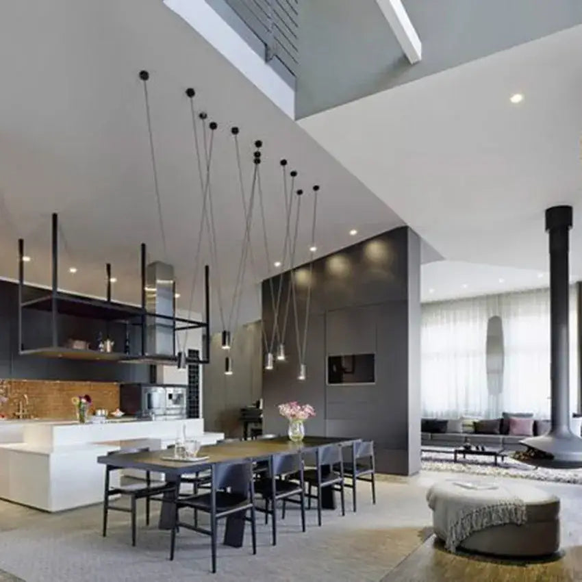 Modern minimalist black geometric vintage linear pendant lamp with slender cords in a contemporary dining space decorbites geometric vintage pendant lamp