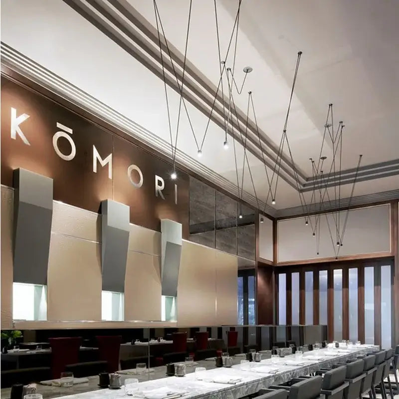 Modern minimalist black geometric vintage linear pendant lamp with sleek kōmori sign on brown and gray panels decorbites geometric vintage