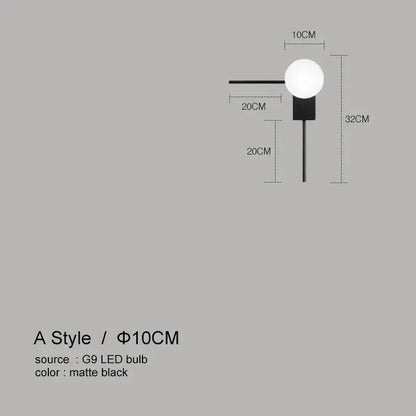 Modern minimalist wall lights featuring a matte black glass ball design with a spherical g9 bulb for bedroom use