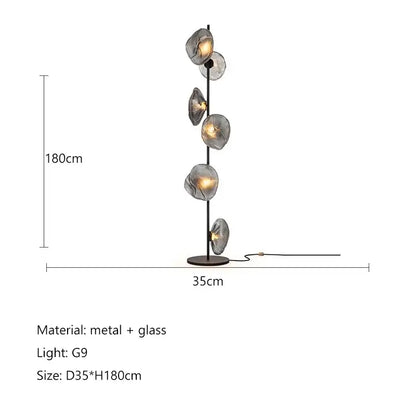 Modern minimalist floor lamp with five translucent gray glass shade led globes on slender black metal pole for home decor