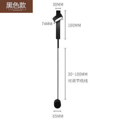 Modern minimalist black and gold wall light sconce with adjustable circular head and cylindrical base for bedroom use