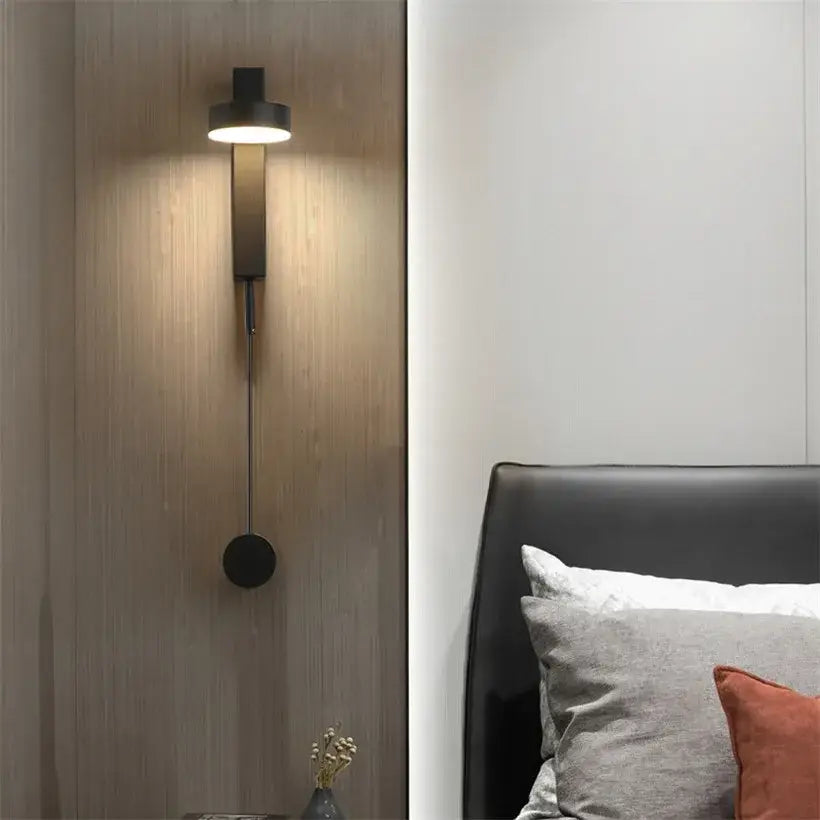 Modern minimalist black and gold t style wall light sconce with sleek design and warm ambient bedroom lighting
