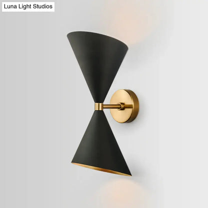 Modern minimalist black matte conical wall light fixture with gold-toned brass accents for bedroom sconce lighting