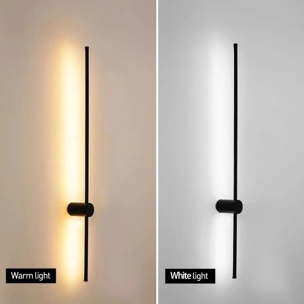 Black minimalist led strip wall lamp with sleek vertical rod and cylindrical base for modern staircase lighting decorbites led strip