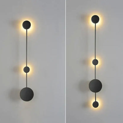 Modern minimalist black led wall lamp with spherical design and warm ambient lighting for living space use