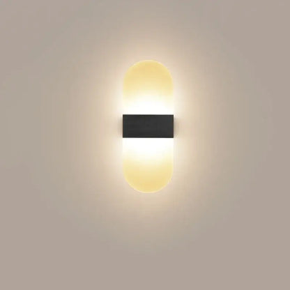 Modern minimalist black led wall light with sleek rectangular center and warm glowing oval diffusers for bedroom decorbites led wall light