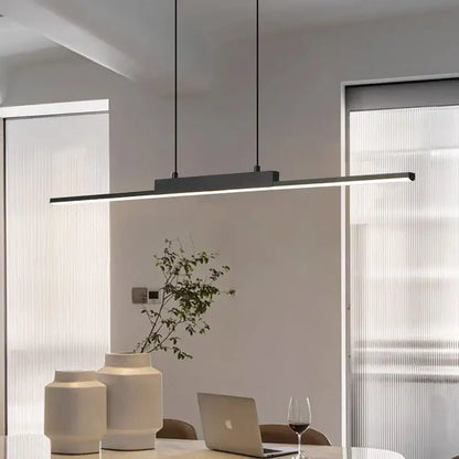 Modern minimalist black linear pendant light with sleek design and thin hanging cords for dining room lighting