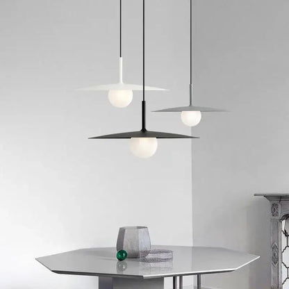 Modern minimalist black and white decorbites flying saucer dining room light with sleek disc-shaped shades and frosted glass globe