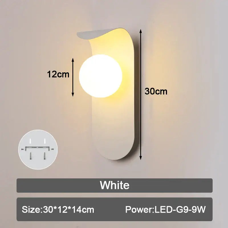 White modern minimalist led wall lamp with frosted glass ball and sleek curved design for bedroom lighting