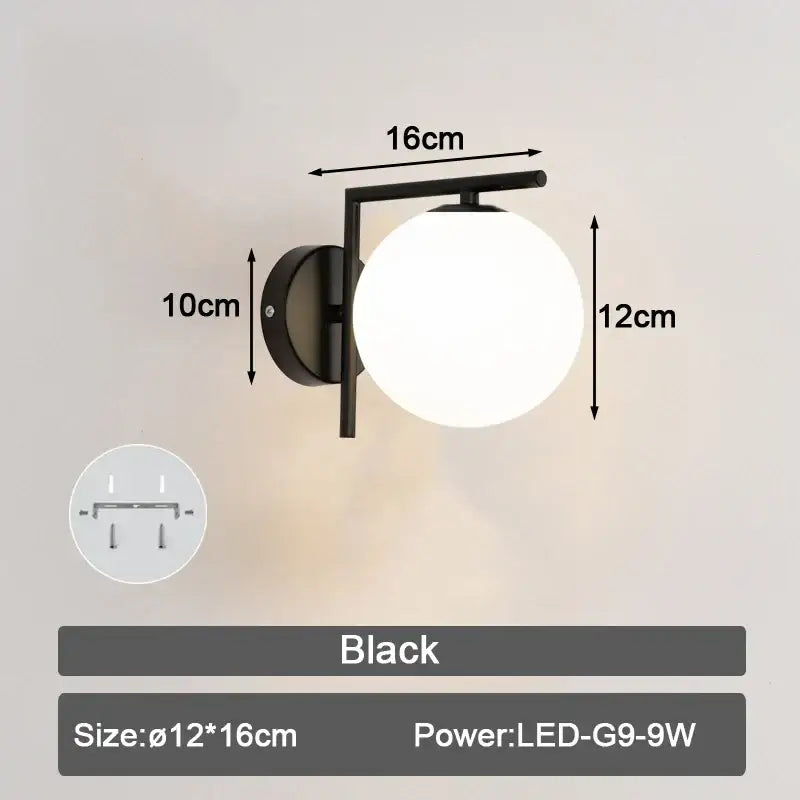 Modern minimalist black led wall lamp with frosted glass ball and metal arm for bedroom lighting