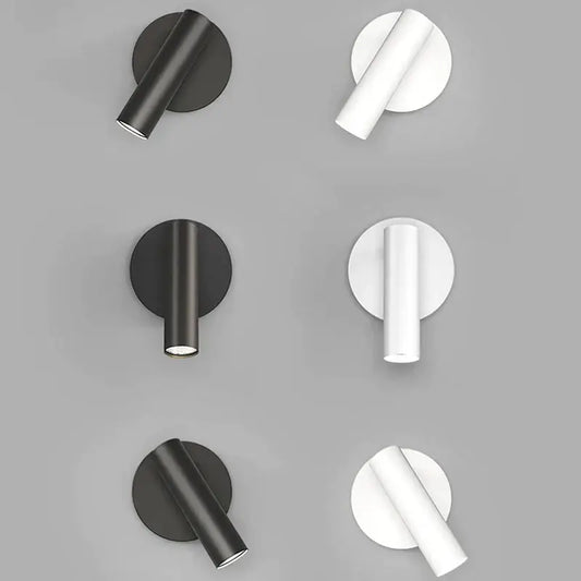 Modern minimalist black and white led wall lamp featuring cylindrical fixtures and circular backplates for bedroom lighting