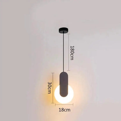 Minimalist black ring pendant lamp with sleek cylindrical shade and glowing bulb ideal for modern dining room decorbites black ring