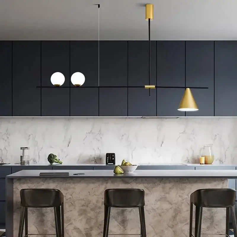 Modern minimalist brass and glass chandelier pendant light with two white globe bulbs and one gold conical shade suspended by black rods