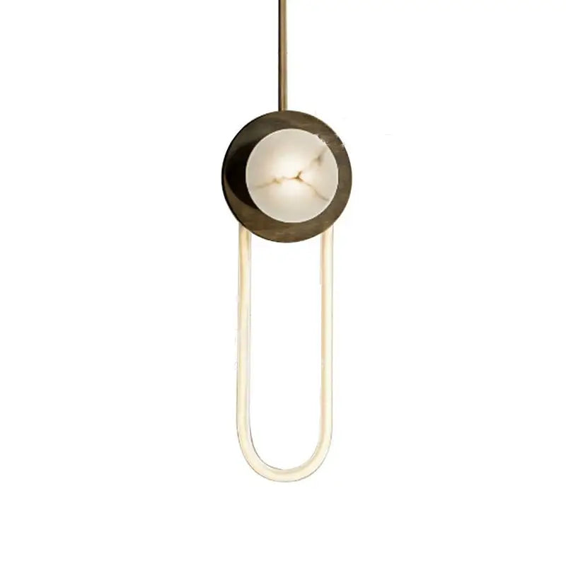 Modern minimalist bronze and white oval wall lamp featuring a warm brass frame with off-white marble disc oval wall sconce