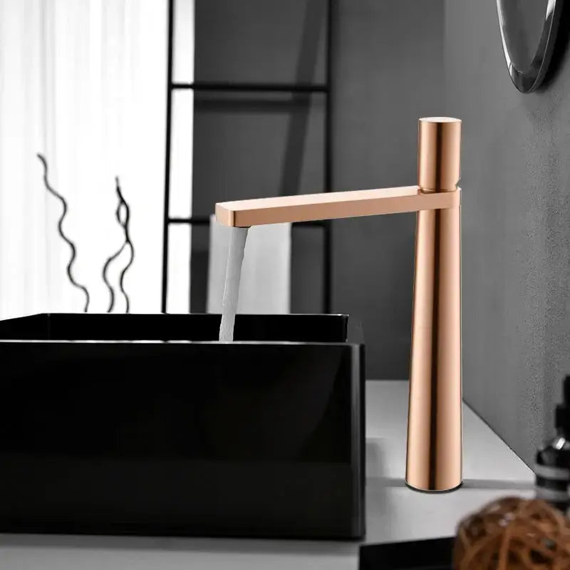 Modern minimalist brushed gold basin faucet with sleek rose gold finish and tall cylindrical spout by decorbites brushed gold