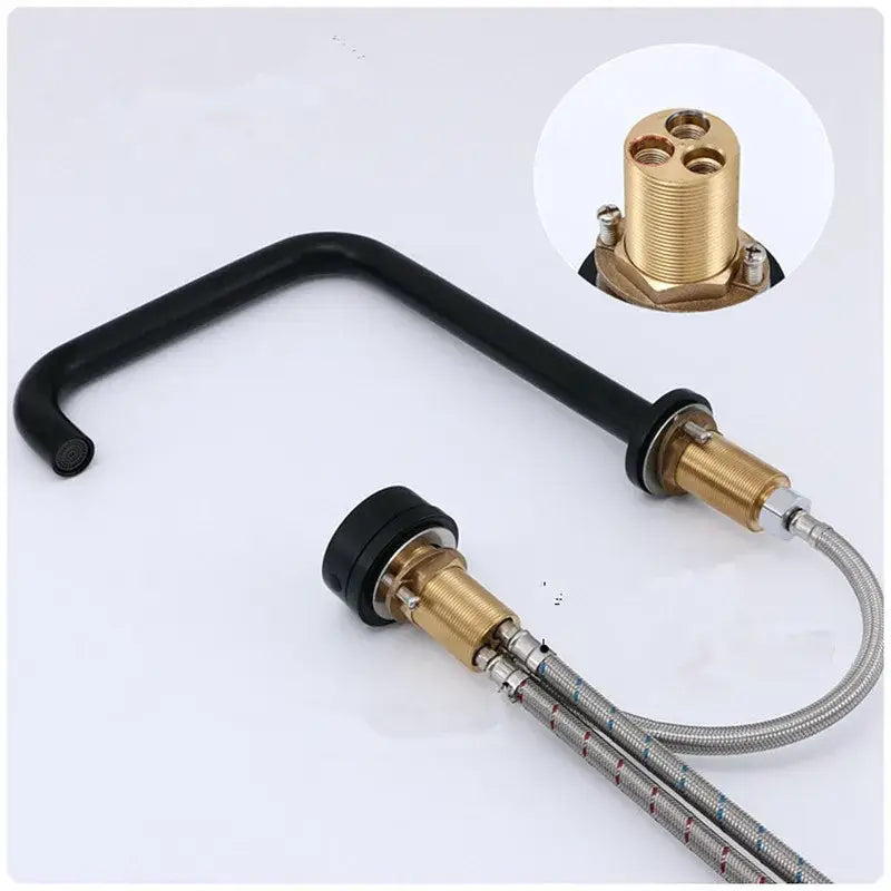 Black curved basin faucet with brass fittings and flexible hoses in decorbites brushed gold minimalist design