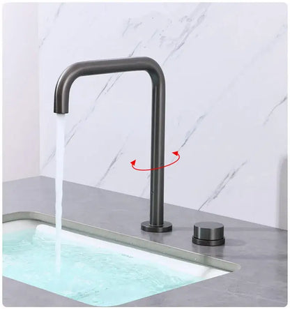 Modern minimalist brushed gold basin faucet with a matte black curved spout and matching cylindrical handle decorbites brushed gold