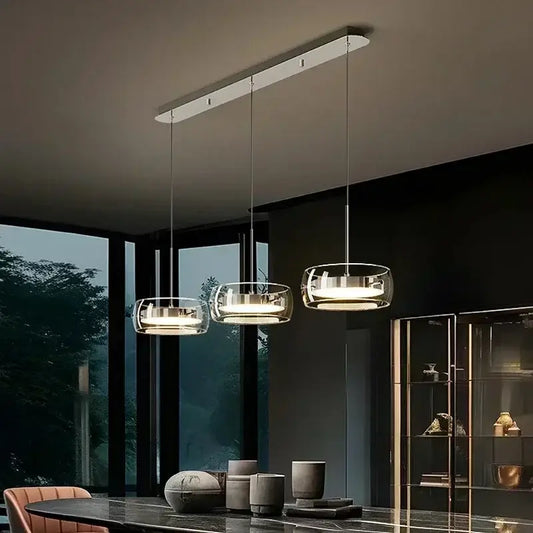 Modern minimalist chrome and glass dining pendant light with transparent shades for decorbites glass dining decor