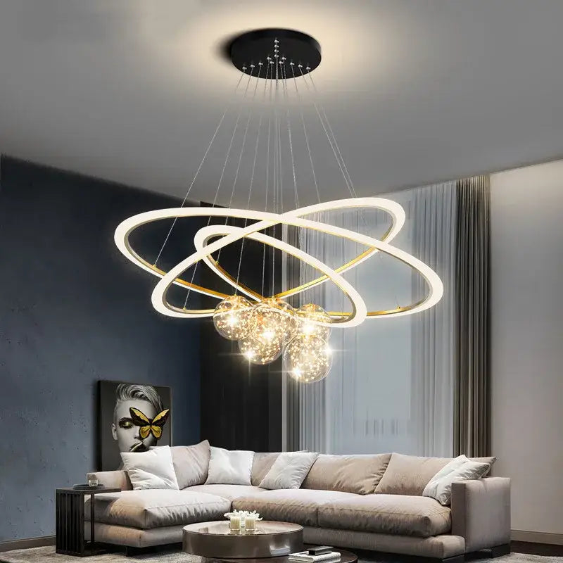 Modern minimalist decorbites circle ring pendant chandelier with gold and white rings and glowing bulbs for living room decor
