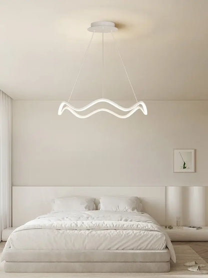 A modern white decorbites circle wave led pendant chandelier with sleek wavy design for dining room decor