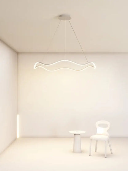 A sleek modern white circle wave led pendant chandelier with minimalist wavy design for dining room decorbites