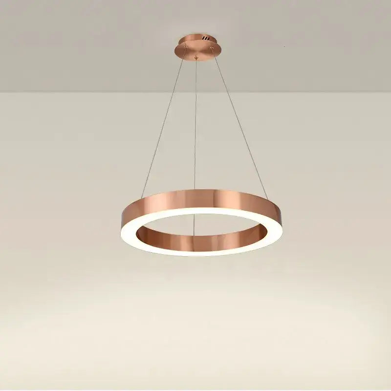 Copper-finished circular gold ring pendant light with sleek modern design for dining room decorbites circular gold decor