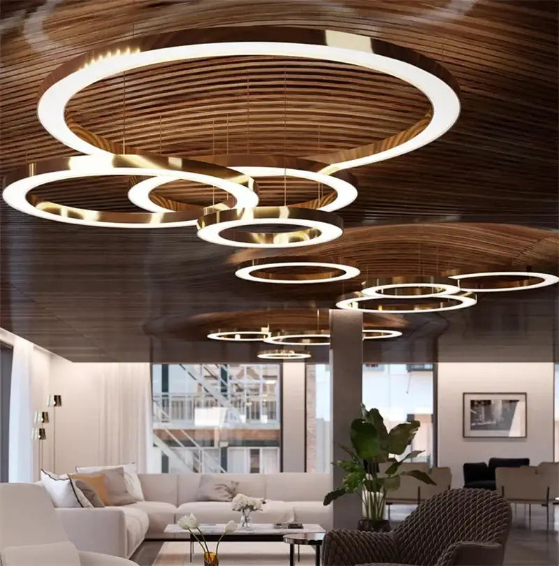 Modern minimalist pendant light featuring circular gold ring led lights with gold-finished metal frame for dining room decorbites circular gold