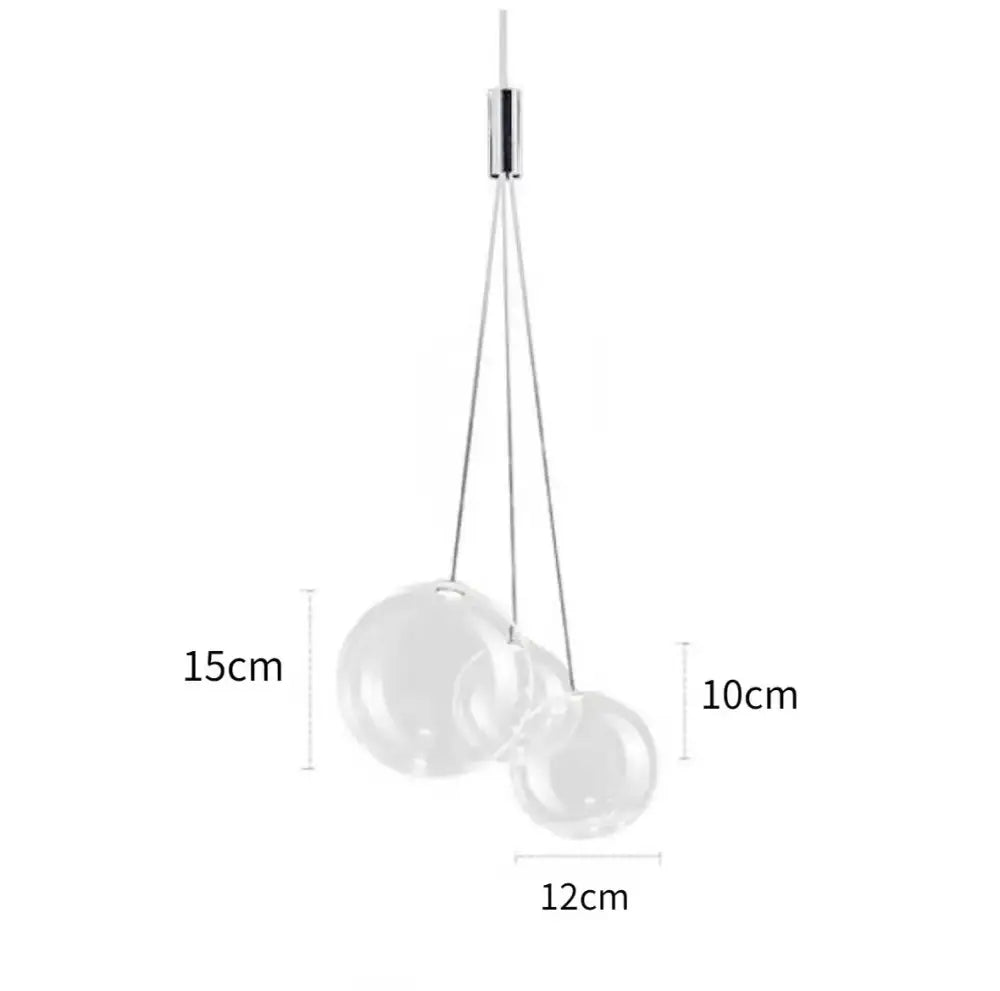 Modern minimalist pendant lamp with two transparent glass ball spheres suspended from a sleek chrome fixture