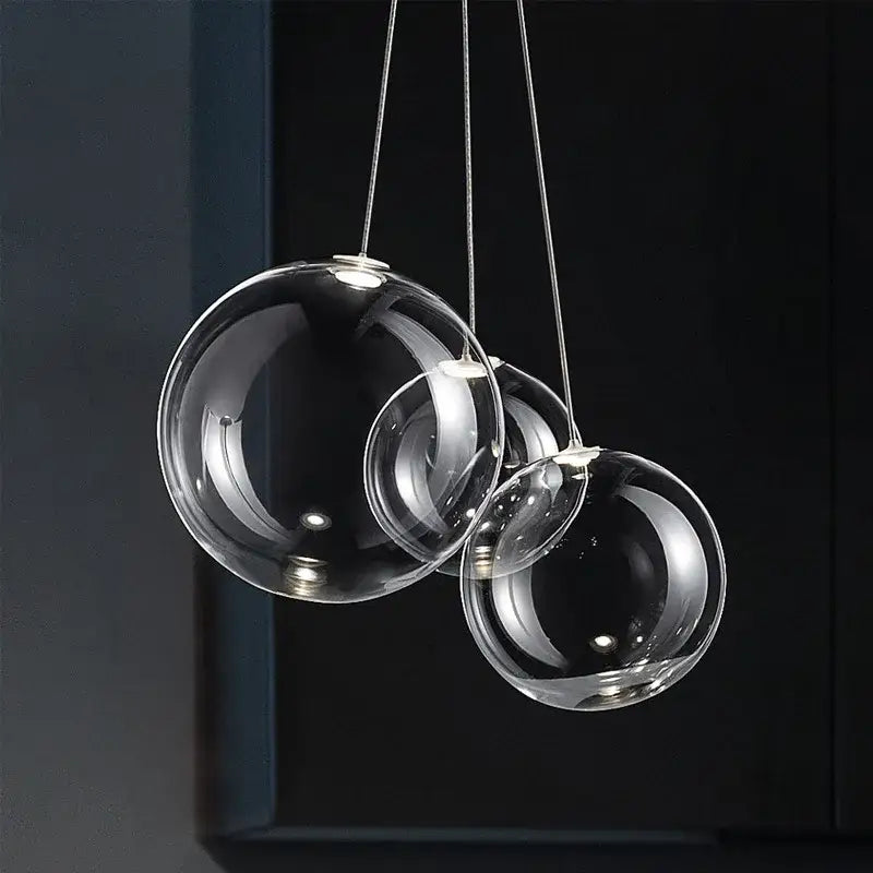 Modern minimalist clear glass ball pendant lamp with spherical design for kitchen decorbites glass ball pendant