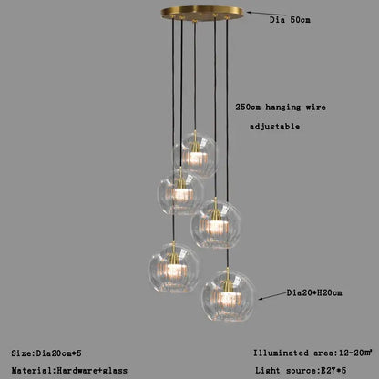 Modern minimalist pendant light with brass finish and five textured clear glass ball shades for dining room decorbites clear glass