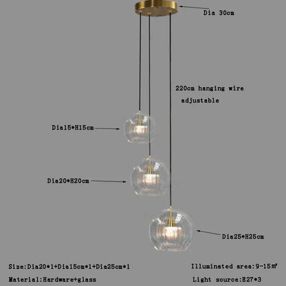 Modern minimalist three-tiered pendant light with clear glass ball globes and brass hardware for dining room decorbites clear glass