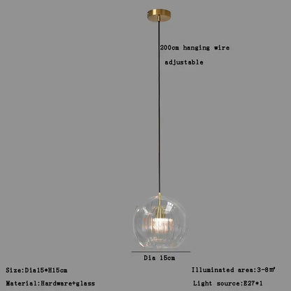 Modern minimalist pendant light with clear glass ball and gold-toned metal fixture for dining room decorbites clear glass