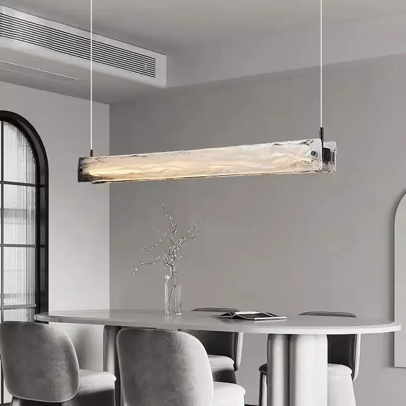 Modern minimalist cloud fog glass pendant light with textured translucent fog glass and metallic ends for dining room