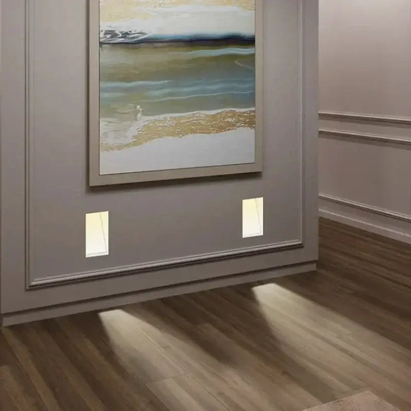 Modern abstract painting with teal gold and white waves displayed near a modern minimalist concrete led underground lamp