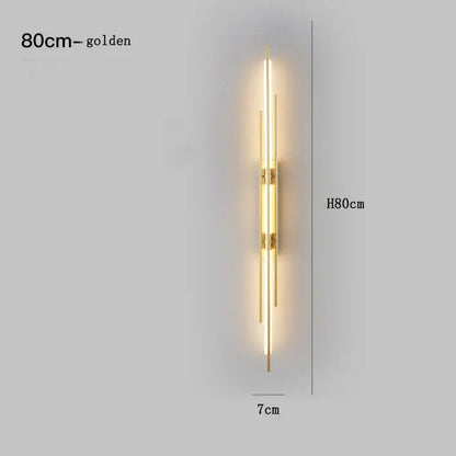 Golden copper wall lamp with vertical led bars and metallic accents designed as a modern minimalist bedroom decorbites wall lamp