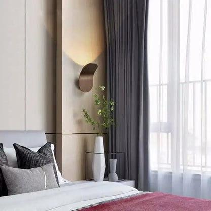 Modern minimalist bronze curved metal led wall lamp with warm ambient glow for living room wall lamps