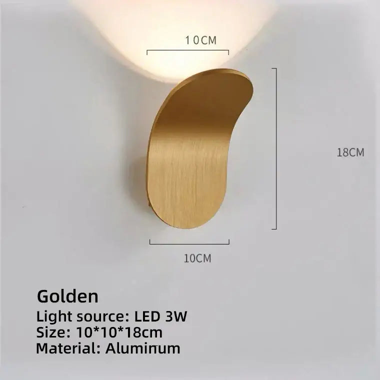A sleek golden aluminum modern minimalist curved led wall lamp for living room with an integrated led light source