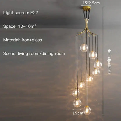 Gold-toned iron modern minimalist decorbites glass ball chandelier with multiple clear globe lights for staircase lighting