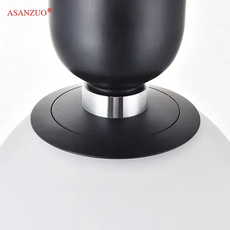 Modern minimalist black asanzuo speaker with matte finish and silver metallic ring base for glass ball led pendant lamp decorbites