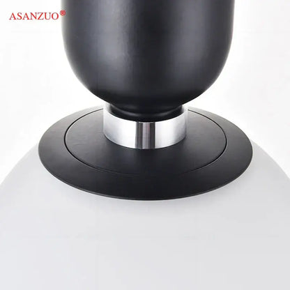 Modern minimalist black asanzuo speaker with matte finish and silver metallic ring base for glass ball led pendant lamp decorbites