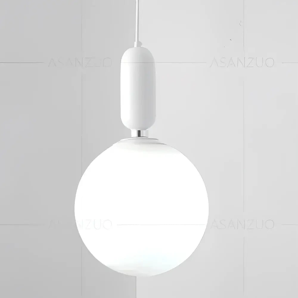 Modern minimalist white pendant lamp with frosted glass ball led and black and gold cylindrical fixture for decorbites