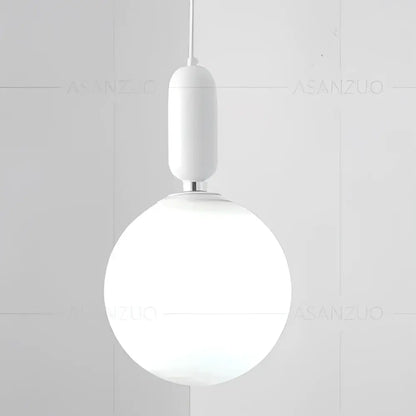 Modern minimalist white pendant lamp with frosted glass ball led and black and gold cylindrical fixture for decorbites