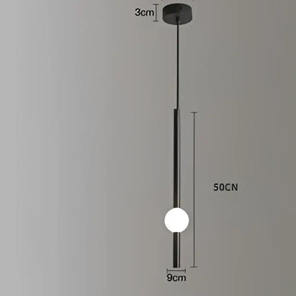 Minimalist black metal rod pendant light with a spherical white glass bulb for modern living room decor