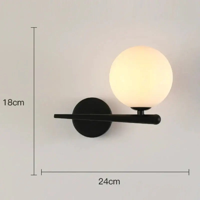 Modern minimalist wall lamp with black matte finish and frosted glass globe warm light decorbites glass gold led