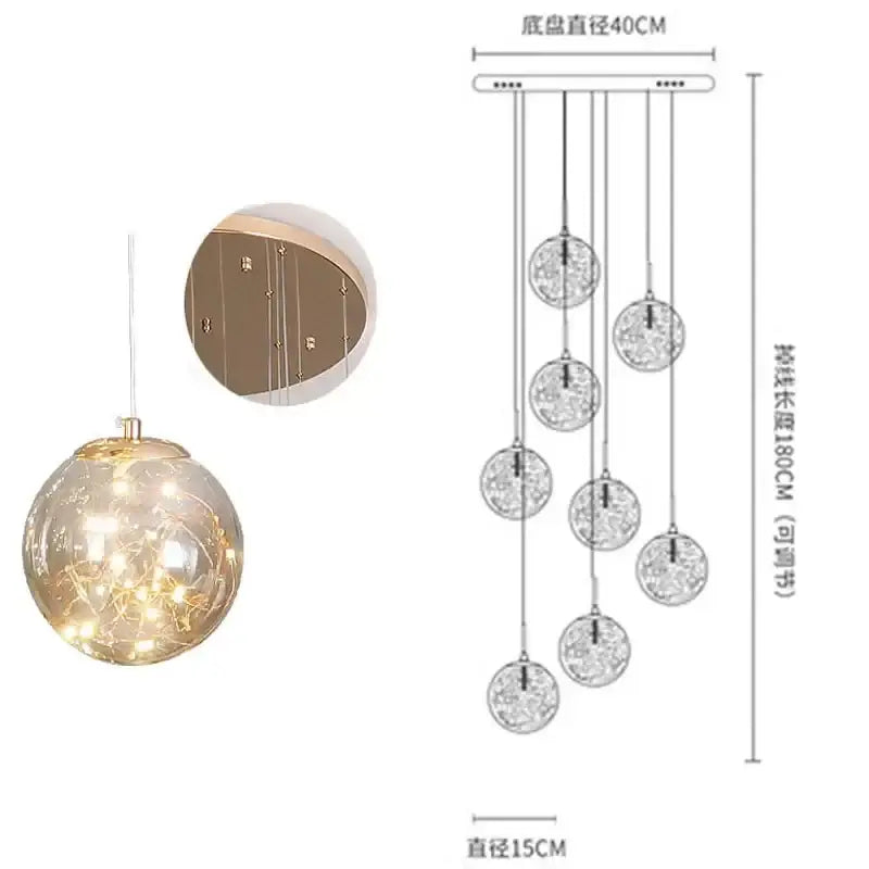 A modern minimalist gold decorbites glass chandelier with tiered spherical orbs and warm LED lights for staircases