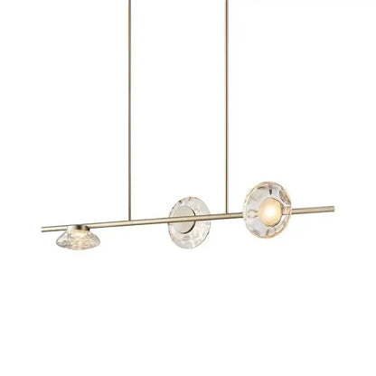 Modern minimalist gold glass led chandelier featuring a brushed brass frame and three faceted crystal shades