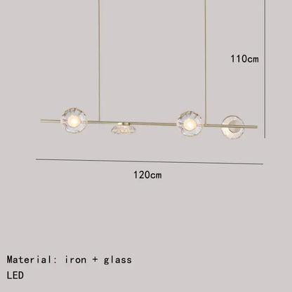 Modern minimalist gold glass led chandelier with sleek iron frame and three clear glass led globe shades for dining room