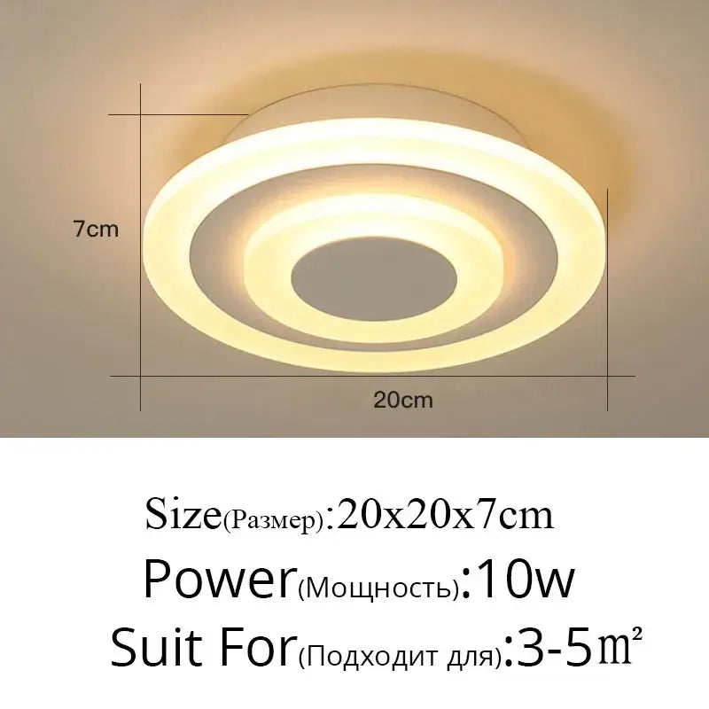 Modern minimalist gold led ceiling light with circular curved arms and concentric rings emitting warm soft glow decorbites led ceiling