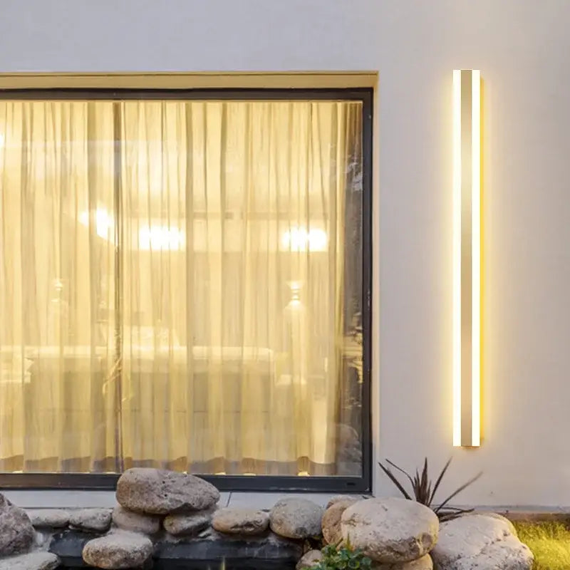 Modern minimalist gold led outdoor wall sconce decorbites gold led vertical design with warm ambient light