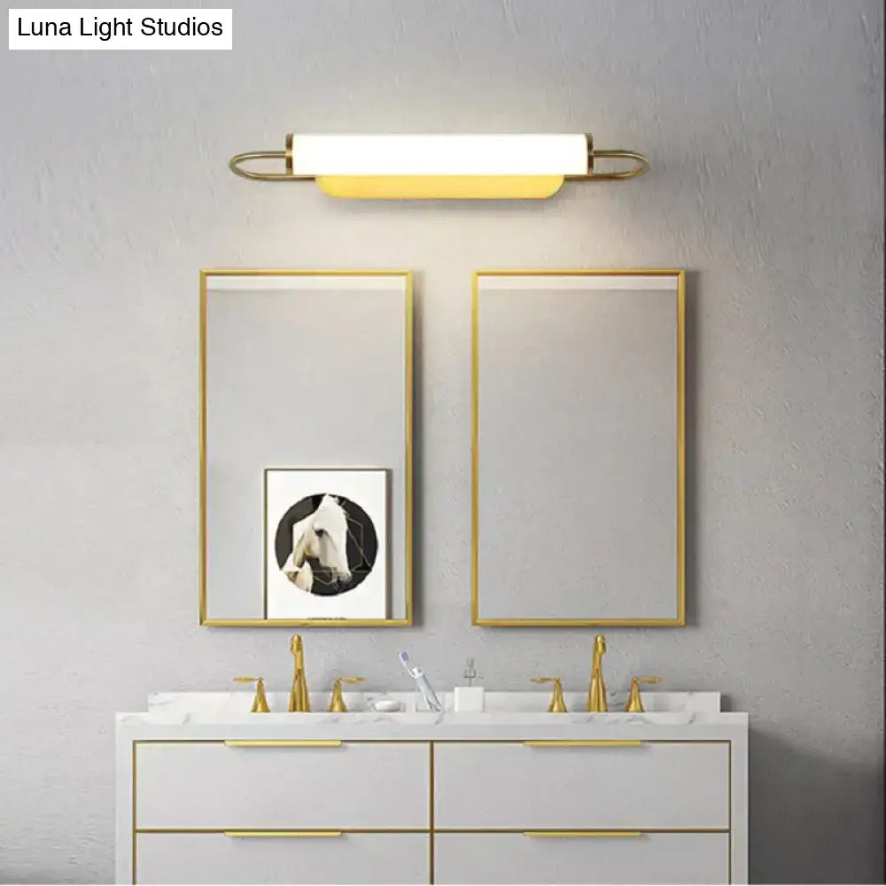 Modern minimalist gold led wall lamp with sleek rectangular design and warm white illumination for bedroom use